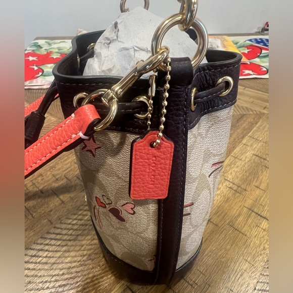 Mini Dempsey Bucket Bag In Signature Canvas With Heart And Star Print - Picture 7 of 8